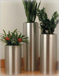 Tall round brushed aluminium planters