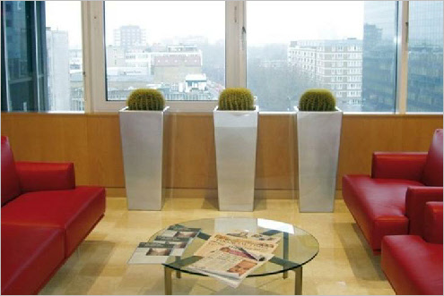 Tall tapered metal planter